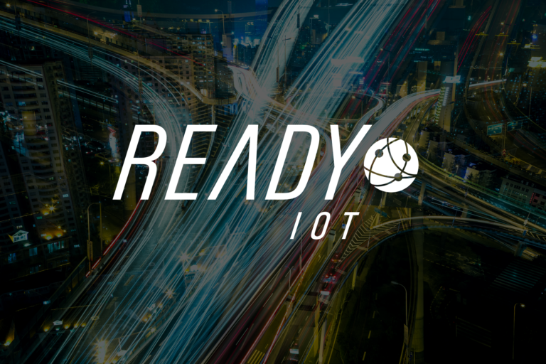 Ready IoT logo over abstract long exposure photo of a highway