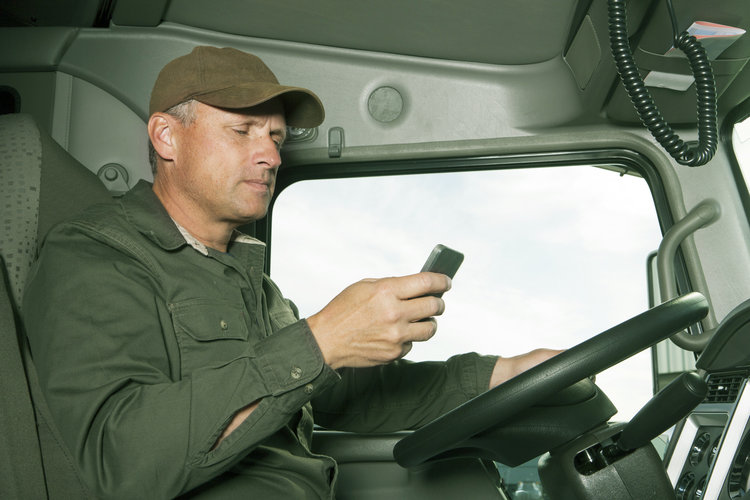 Truck driver distracted by cellphone while driving