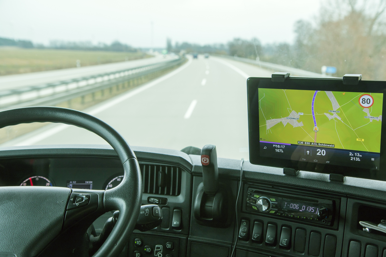 Truck driver using GPS to navigate